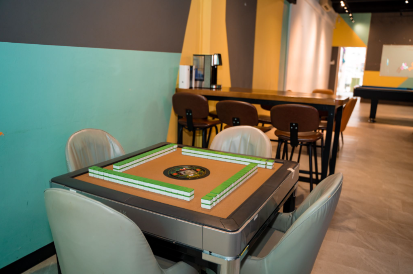 Corporate event venue with automated mahjong table